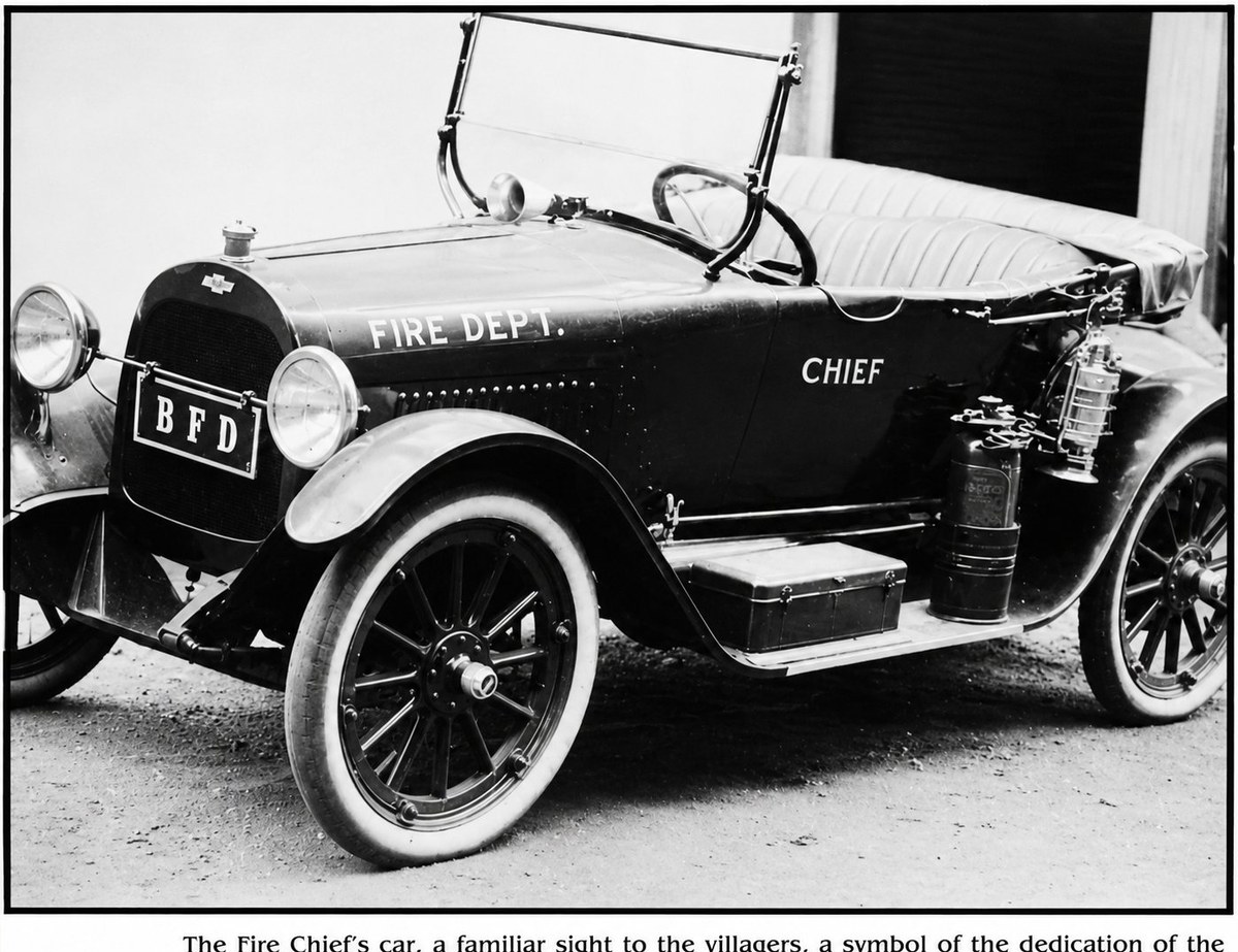 The Brewster Fire Department chief's car, a 1920s open-top touring automobile. The hood reads 'FIRE DEPT.'; the front bumper plate reads 'BFD'; the driver's-side body panel reads 'CHIEF'. A polished siren is mounted on the cowl ahead of the steering wheel. Two brass-bound fire extinguishers and a small metal toolbox sit on the running board. The car has white-wall tires and wood-spoked wheels, and is parked outside what appears to be a firehouse bay.