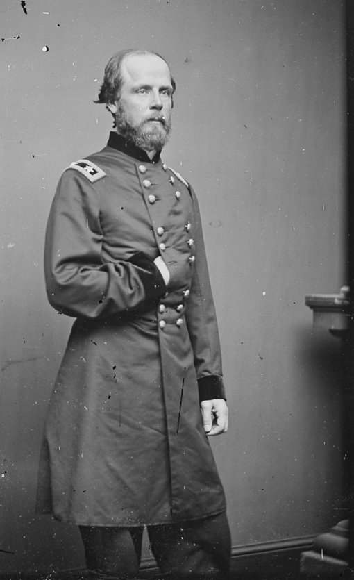 Full-length standing photograph of Major General Darius Nash Couch in his Union frock coat with the two-star shoulder strap of a major general. The original glass plate shows characteristic dust and scratch marks of an unrestored period negative.