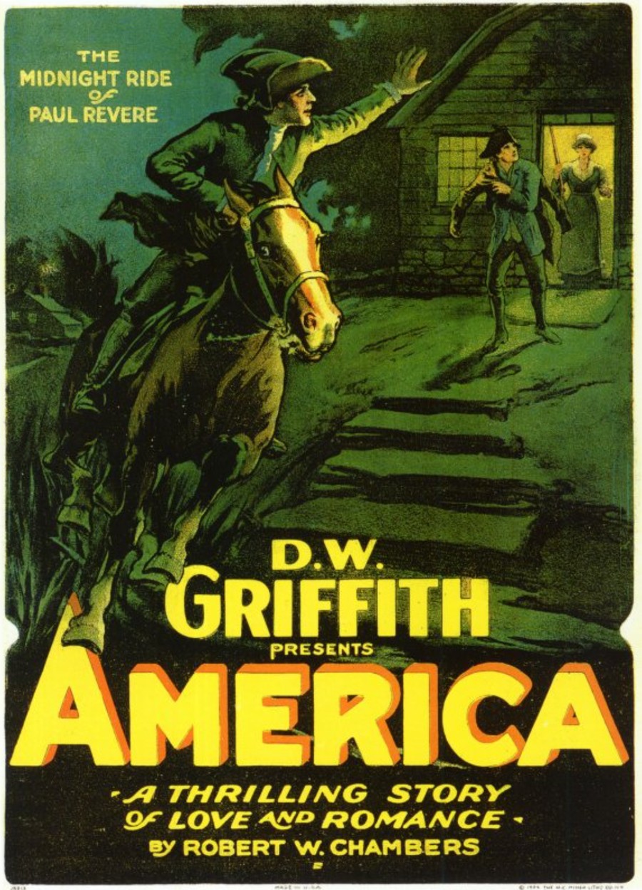 Colour lithographed film poster in green, black, and yellow: a rider in a tricorne hat rears his horse before a stone cottage at night, one arm raised toward a lit doorway where a woman holds a musket and a man starts forward. Lettering reads &lsquo;The Midnight Ride of Paul Revere&rsquo; and &lsquo;D. W. Griffith presents America &mdash; a thrilling story of love and romance &mdash; by Robert W. Chambers.&rsquo;