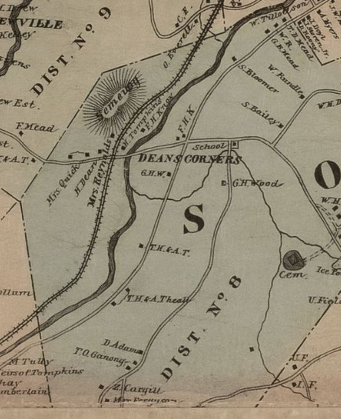 Detail of an 1876 county map, tinted pale green: dash-and-dot lines divide school districts labelled Dist. No. 9 and Dist. No. 8, with Deans Corners, a school, a starburst-marked cemetery, and an ice pond. Farmstead dots are named F. Mead, Mrs. Quick, Mrs. Reynolds, F.H. Knox, G.H. Wood, S. Bailey, W. Rundle, T.H. & A. Theall, D. Adams, and T.O. Ganong.