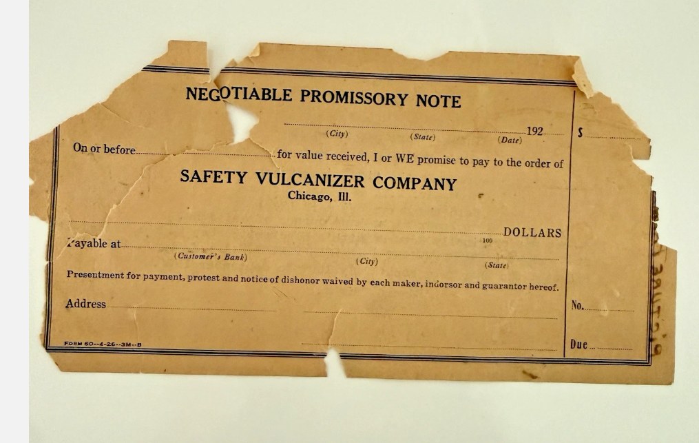 Torn blank promissory note form: Negotiable Promissory Note, promising payment to the order of Safety Vulcanizer Company, Chicago, Ill.