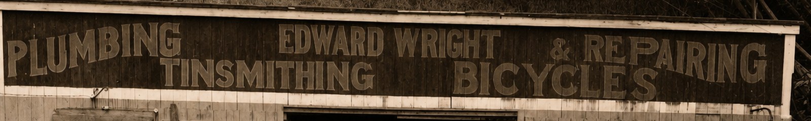 AI-rendered version of the same sign band, sharply legible: PLUMBING, EDWARD WRIGHT, & REPAIRING; TINSMITHING, BICYCLES.