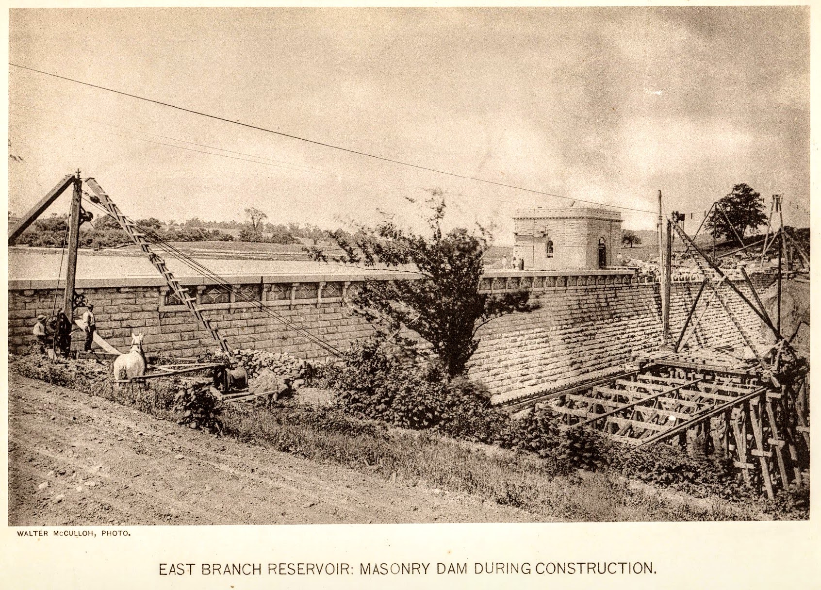 East Branch Reservoir: Masonry Dam During Construction — back of dam, late construction
