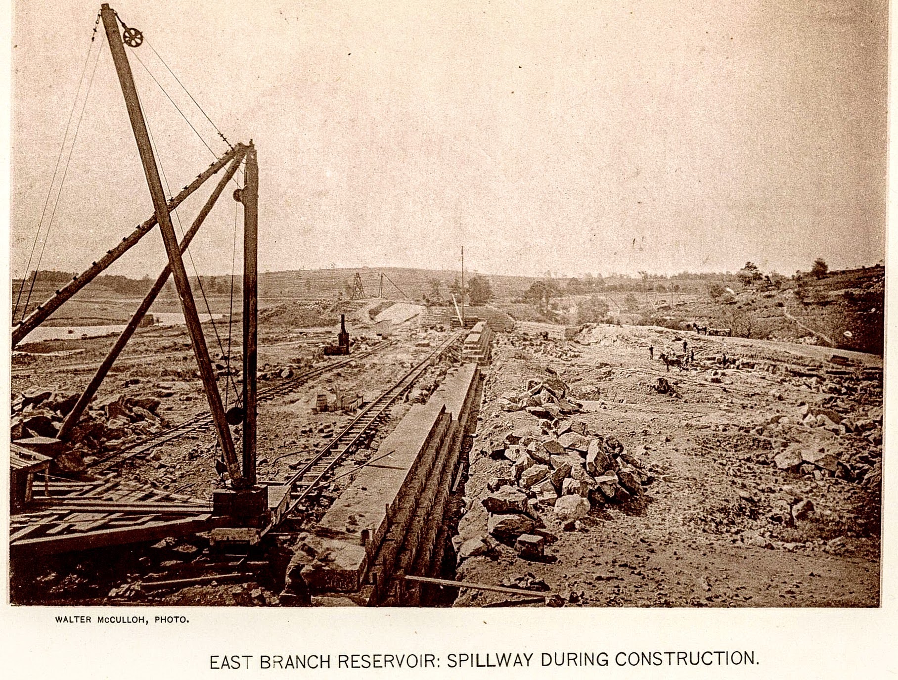 East Branch Reservoir: Spillway During Construction — derrick crane and stone channel