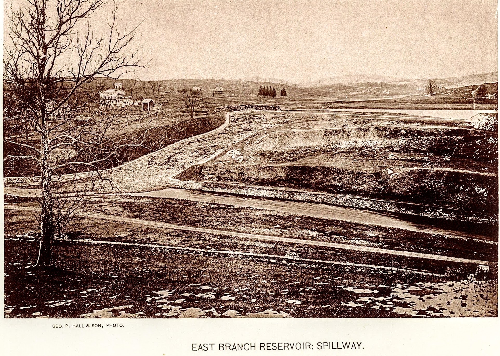 East Branch Reservoir: Spillway — completed, with the Presbyterian church visible on the hillside