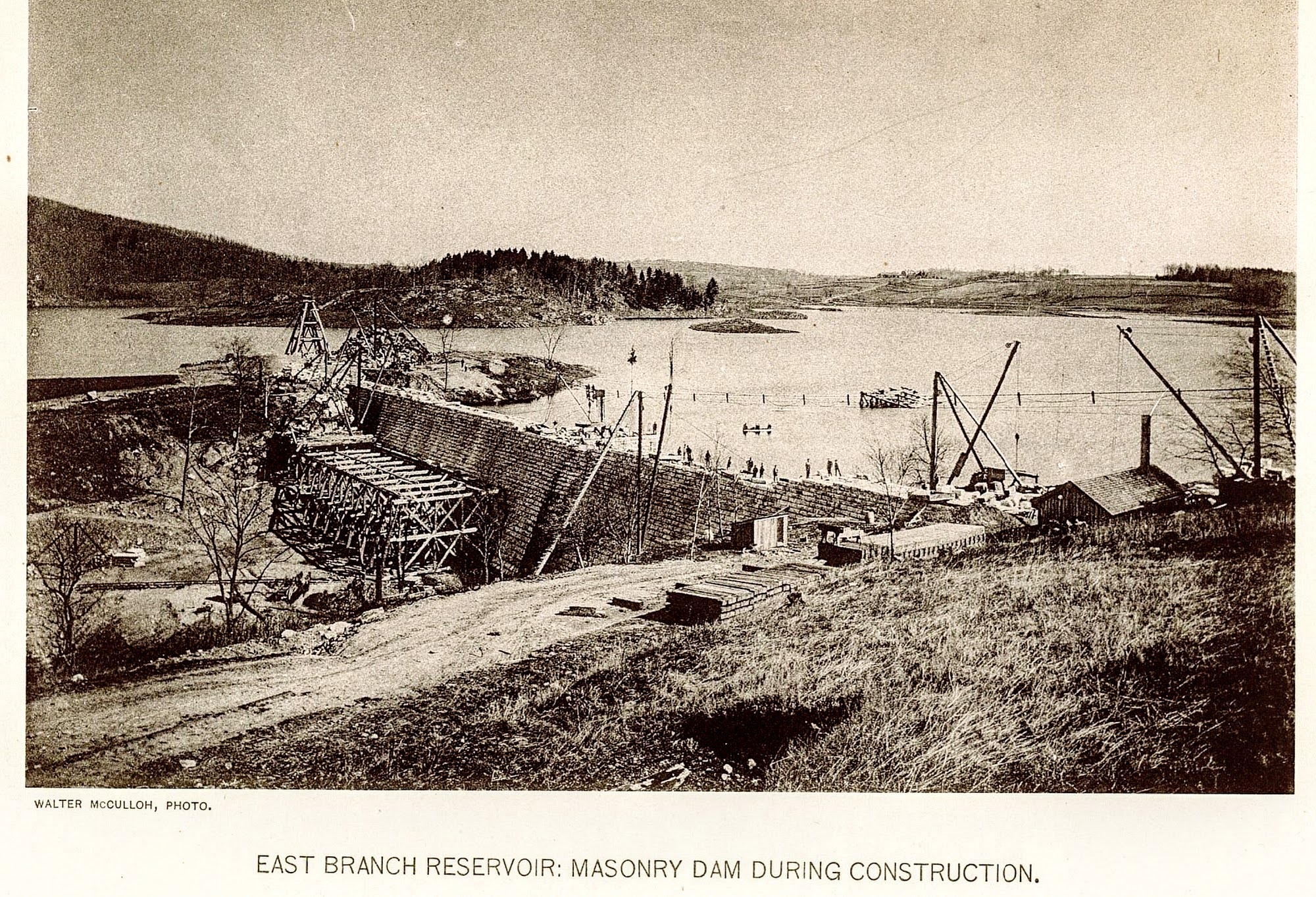 East Branch Reservoir: Masonry Dam During Construction — wide elevated view with water already rising