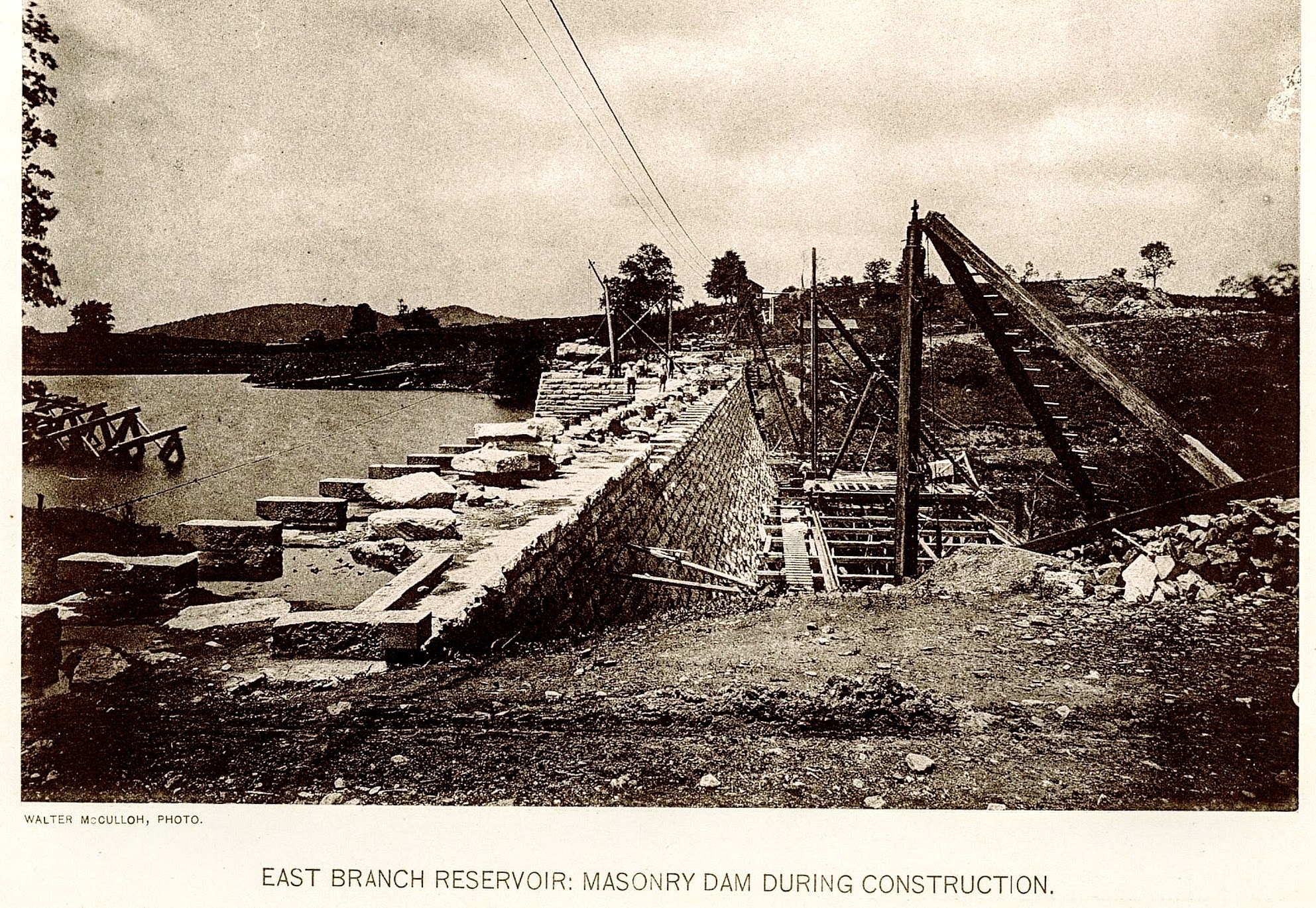 East Branch Reservoir: Masonry Dam During Construction — looking along the crest with stone blocks