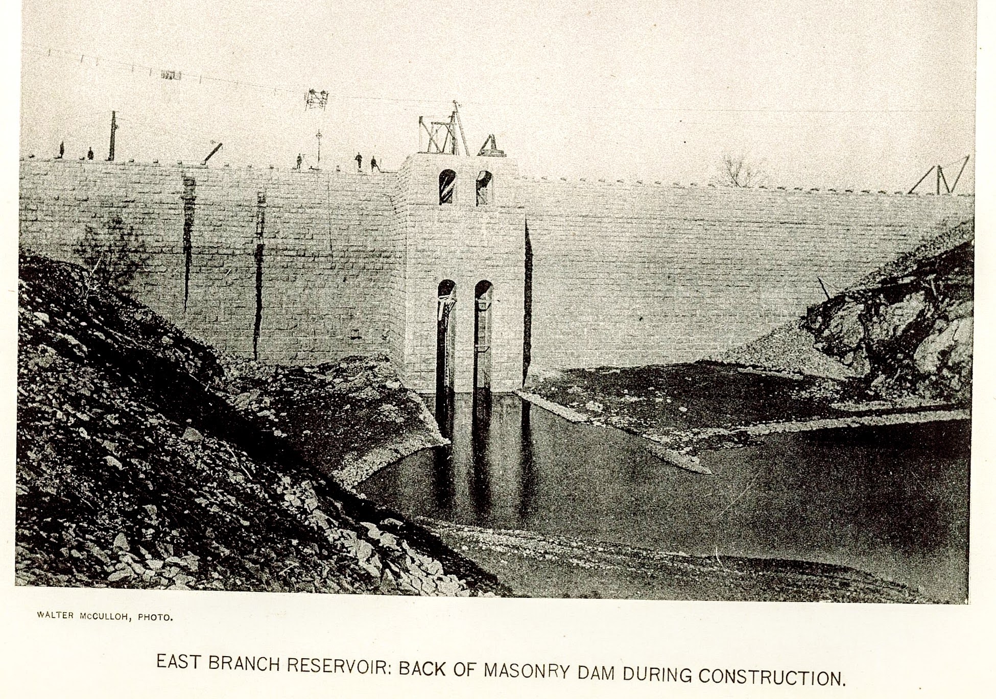 East Branch Reservoir: Back of Masonry Dam During Construction — gatehouse tower detail