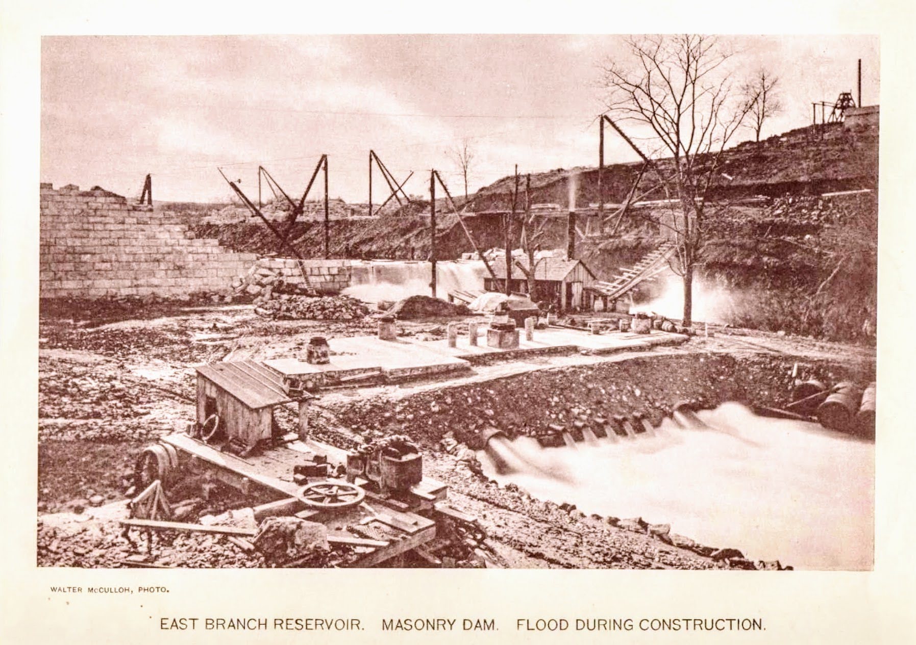 East Branch Reservoir: Masonry Dam, Flood During Construction — water cascading over temporary works
