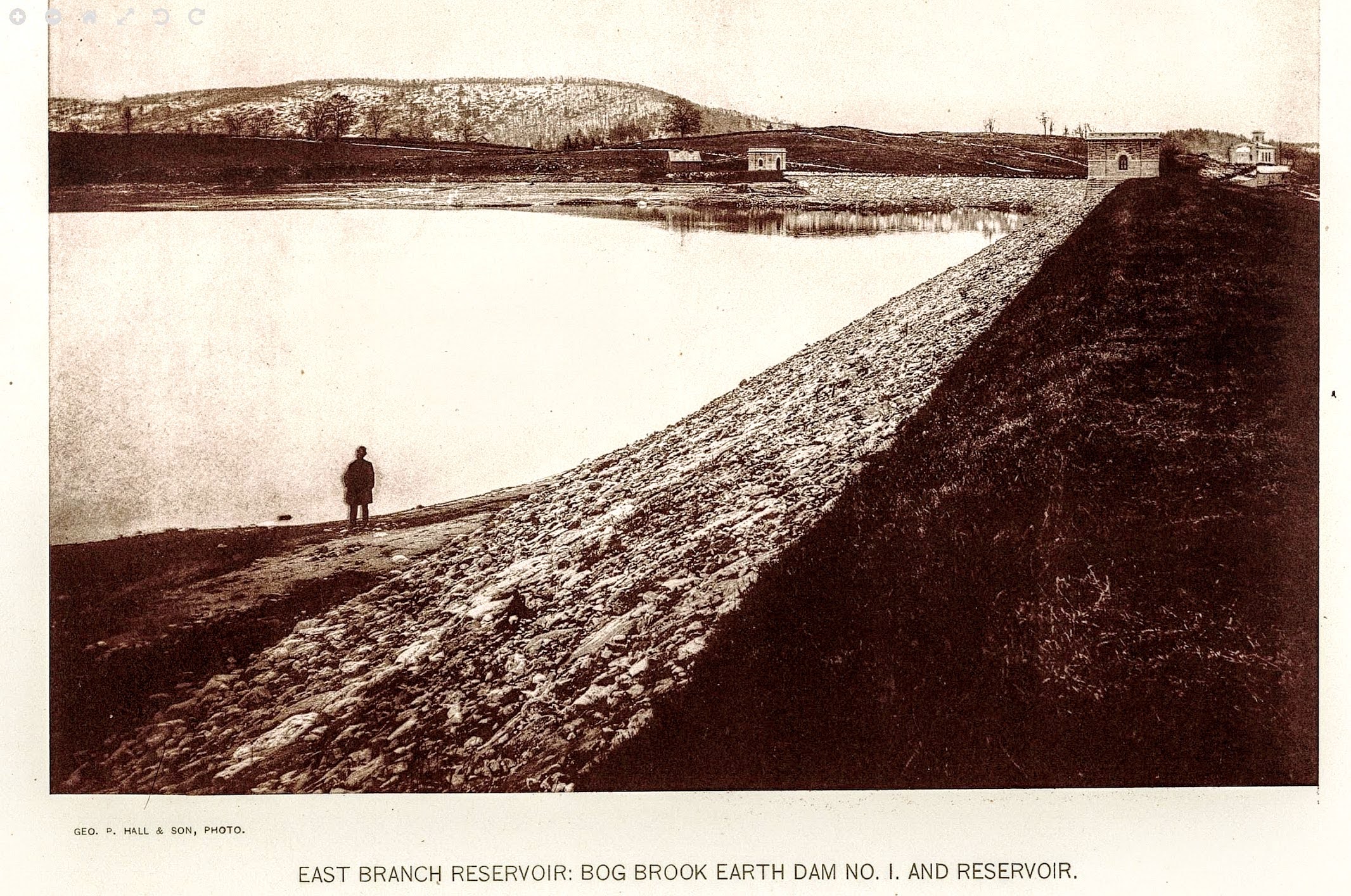East Branch Reservoir: Bog Brook Earth Dam No. 1 and Reservoir — completed, solitary figure on the dam